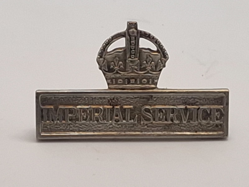 Imperial Service Badge. Dette mærke blev tildelt medlemmer af Territorial Force (TF) i Storbritannien, som var villige til at tjene uden for Storbritannien i tilfælde af en national nødsituation