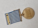 De Forenede Nationers Koreamedalje (United Nations Service Medal for Korea – UNSMK). 