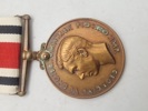 Original “Special Constabulary Long Service Medal". med navn 