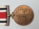 Original “Special Constabulary Long Service Medal". med navn 