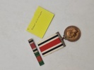 Original “Special Constabulary Long Service Medal". med navn 