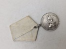 Original sovjetisk medalje kendt som "Medal for Saving the Drowning" (Медаль «За спасение утопающих»).