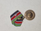 Original FN-medalje, som er en international dekoration tildelt af De Forenede Nationer (FN) til militært og politimæssigt personale, der har deltaget i FN-operationer. 