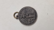 Original tysk jernmedalje (Eisenmedaille) fra Første Verdenskrig. 
Betydning: Denne medalje var en privat udstedt medalje, der blev givet til dem, der bidrog med smykker til en fond.