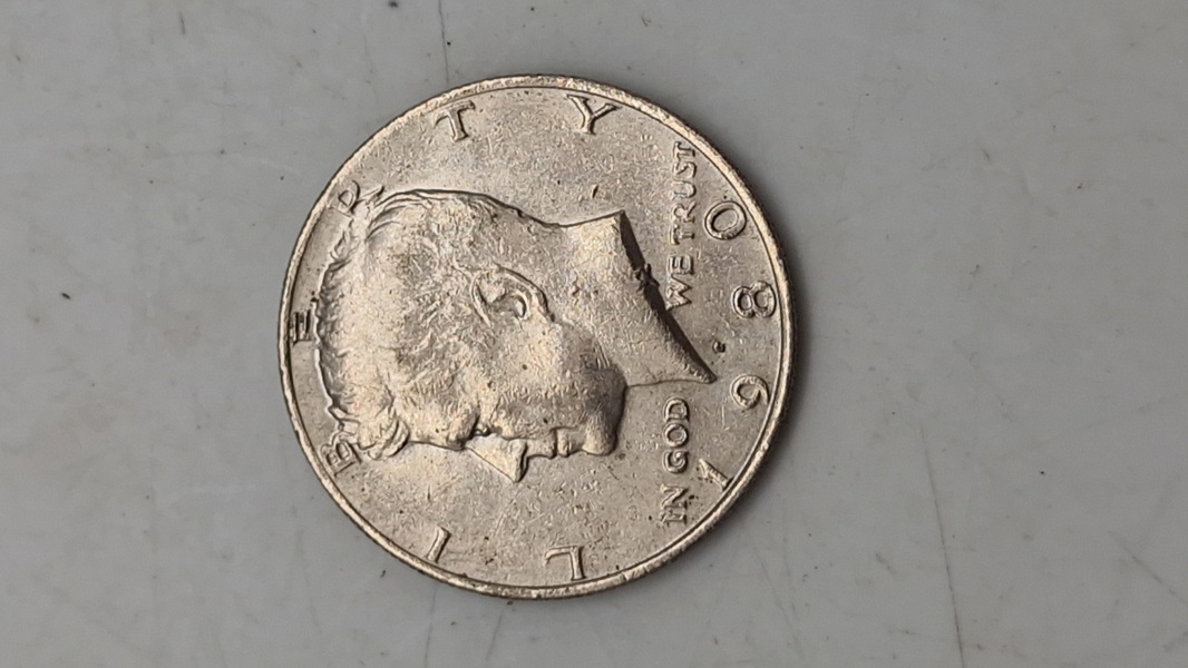 Original Kennedy Half Dollar, en halvdollar-mønt udstedt af United States Mint