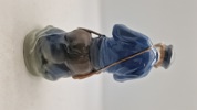 Royal Copenhagen-figur nr. 905, også kendt som "Hyrdedreng der snitter i gren" eller "The Whittler"