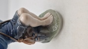 Royal Copenhagen-figur nr. 905, også kendt som "Hyrdedreng der snitter i gren" eller "The Whittler"