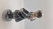 Royal Copenhagen figur kaldet "Flugten til Amerika" (model 1761), designet af Christian Thomsen i 1915