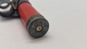 Løs 12,7 mm patron i plast med led. Afskudt 
